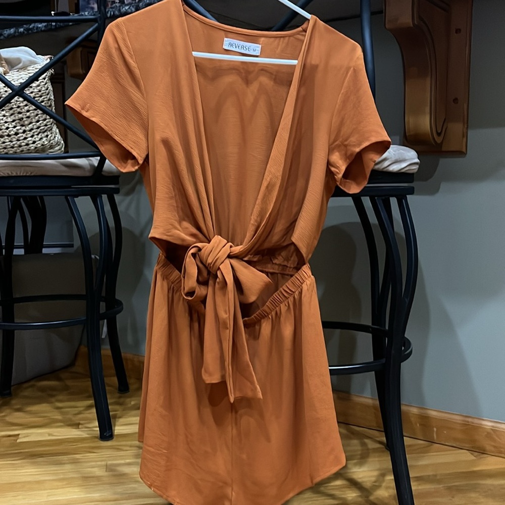 Reverse Rust colored romper, size M. Deep V in from w/ bowtie close! Unique!
